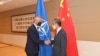 中國外長王毅（右）與北約秘書長斯托爾滕貝格。