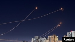 FILE PHOTO: Israel's Iron Dome anti-missile system intercepts rockets launched from the Gaza Strip