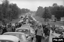 FILE - In this Aug. 16, 1969 file photo, hundreds of rock music fans jam a highway leading from Bethel, New York, as they try to leave the Woodstock Music and Art Festival.