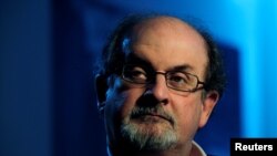 FILE PHOTO: British author Salman Rushdie listens during an interview with Reuters in London