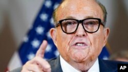 FILE - Former Mayor of New York Rudy Giuliani, a lawyer for President Donald Trump, speaks during a news conference in Washington, Nov. 19, 2020.