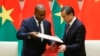 China's Foreign Minister Wang Yi, right, and Burkina Faso Foreign Minister Alpha Barry attend a signing ceremony establishing diplomatic relations between the two countries in Beijing, May 26, 2018.