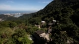 Houses in the Enchanted Valley community stand outside of Tijuca National Forest in Rio de Janeiro, Brazil on June 6, 2022. (AP Photo/Bruna Prado)