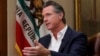 In this file photo taken on Oct. 8, 2019, California Gov. Gavin Newsom gestures during an interview in Sacramento, Calif.