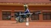 Lonh Vannsith, a fourth-year student of the National Polytechnic Institute of Cambodia, flies his team's drone in Phnom Penh, Cambodia, on September 17, 2021. REUTERS/Cindy Liu