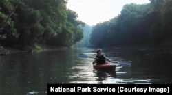 A person kayaks on the Green River