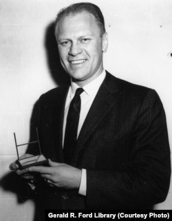 Comedians often portrayed Ford as clumsy. But Ford was an accomplished athlete who enjoyed golf, swimming, and skiing. Here he is as a congressman, holding an award from Sports Illustrated magazine.