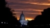 FILE - The U.S. Capitol Building is illuminated during sunrise in Washington.