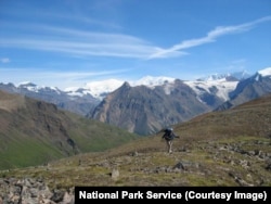 A backpacker hikes in the backcountry area of Wrangell-St. Elias National Park