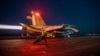In this on Feb. 24, 2024, image released by the US Central Command, a US fighter plane launches from the deck of the aircraft carrier USS Eisenhower in the Red Sea during operations against Huthi targets.