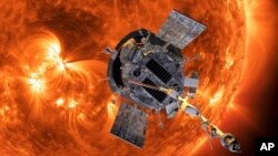 This image made available by NASA shows an artist's rendering of the Parker Solar Probe approaching the Sun. (Steve Gribben/Johns Hopkins APL/NASA via AP)