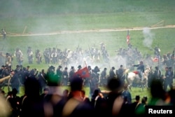 Actors reenact Pickett's Charge during the 150th anniversary of the Battle of Gettysburg.