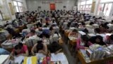 In this June 2, 2012 photo, students prepare for the university entrance exam in a classroom in Hefei, Anhui Province. If you read the room here, what would the mood be? (REUTERS/Stringer)