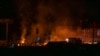 Спасатели тушат пожар на месте атаки российского беспилотника в Харькове. 6 апреля 2024 года. (AP Photo/Алекс Бабенко).