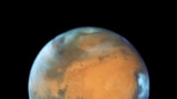 This May 12, 2016 image provided by NASA shows the planet Mars. (NASA/ESA/Hubble Heritage Team - STScI/AURA, J. Bell - ASU, M. Wolff - Space Science Institute via AP)