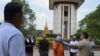 Borby Orn tells new deportees about the killing field site at Wat Snguon Pich pagoda in Cambodia.