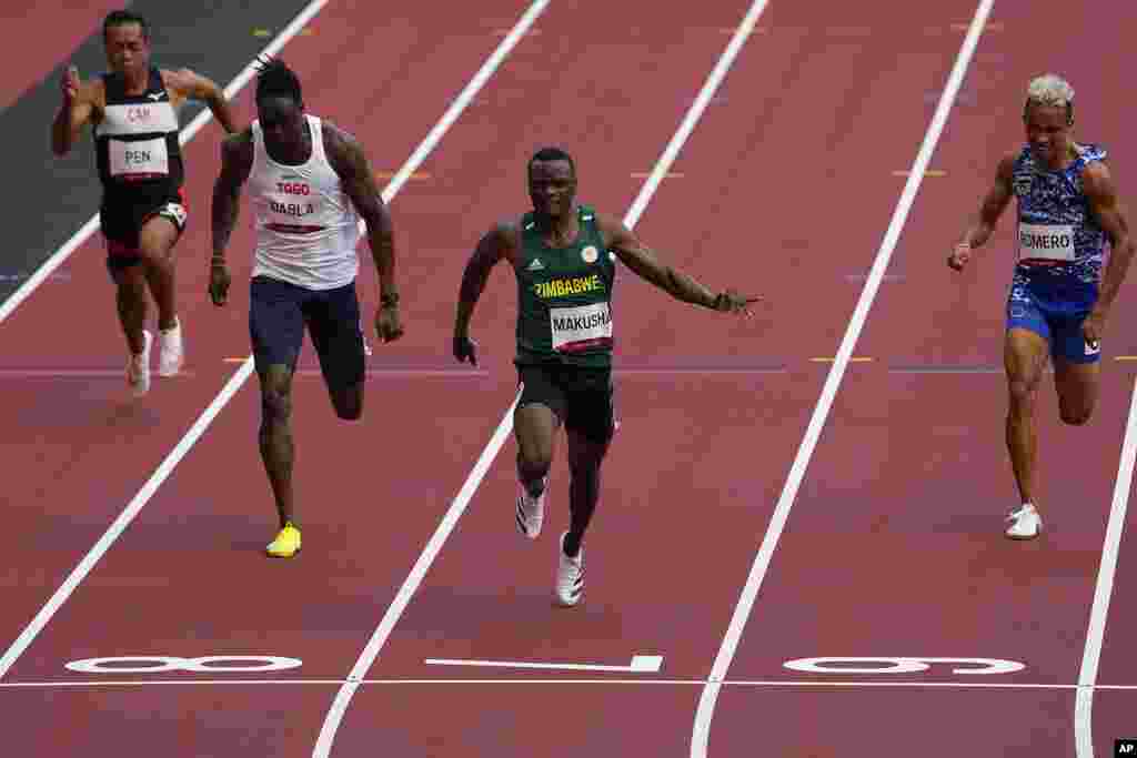 Ngoni Makusha, of Zimbabwe, wins a heat in the men&#39;s 100-meter run at the 2020 Summer Olympics, Saturday, July 31, 2021, in Tokyo. (AP Photo/Charlie Riedel)