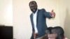 FILE - South Sudanese academic and activist Peter Biar Ajak, gestures during his trial in the capital Juba, South Sudan, March 25, 2019.