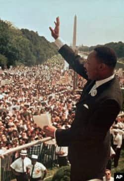 FILE - Martin Luther King Jr. acknowledges the crowd at the Lincoln Memorial for his "I Have a Dream" speech during the March on Washington, August 28, 1963. King was later assassinated. (AP Photo/File)