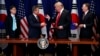 President Donald Trump hands a pen to South Korean President Moon Jae-In during a signing ceremony for the United States-Korea Free Trade Agreement during the United Nations General Assembly, Monday, Sept. 24, 2018, in New York. 