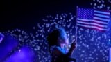 FILE - A child watches the Macy's Fourth of July fireworks in New York City, New York, U.S., July 4, 2021. (REUTERS/Andrew Kelly)