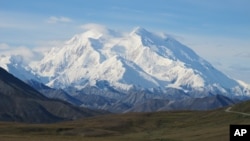 Mt. McKinley is seen on a rare sunny day this summer on Friday, Aug. 19, 2011, in Denali National Park, Alaska. Mt. McKinley is the highest mountain peak in North America and the United States, with a summit elevation of 20,320 feet (6,194 m) above sea level. (AP Photo/Becky Bohrer)