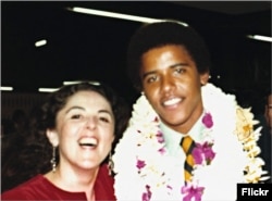 Barack Obama with his mother at his high school graduation
