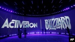 In this file photo, the Activision Blizzard Booth is shown on June 13, 2013, during the during the Electronic Entertainment Expo in Los Angeles. (AP Photo/Jae C. Hong, File)