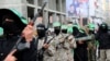 Masked militants from a military wing of Hamas commemorate the 29th anniversary of their group, in Gaza City, Dec. 14, 2016. 