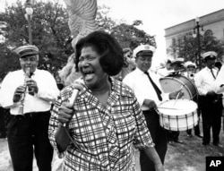 Mahalia Jackson sings "Just a Closer Walk with Thee" to the beat of the Eureka Brass Band at the first New Orleans Jazz Festival on April 23, 1970.