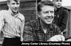 Jimmy Carter and two of his sons at the family farm. Jimmy and Rosalynn went on to have a daughter as well. (Courtesy of Jimmy Carter Library)
