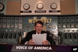 FILE - President Ronald Reagan gives his weekly radio address, on Saturday, November 9, 1985, at the Voice of America studio in Washington. (AP Photo)