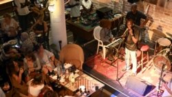 Guitarist Moustapha Diol addresses the audience at the Hotel De La Residence during the Saint Louis Jazz Festival in Saint Louis, Senegal, June 19, 2021. Picture taken June 19 2021. REUTERS/Cooper Inveen