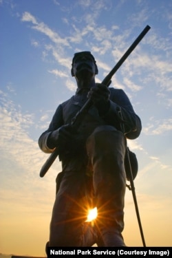 The bronze likeness of a Union trooper, carbine at the ready, sits atop the monument to the 1st Pennsylvania Cavalry.
