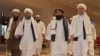 FILE - Taliban officials walk down a hotel lobby during talks in Doha, Qatar, Aug. 12, 2021. UN Secretary-General António Guterres will convene a meeting of various countries’ special representatives for Afghanistan in Qatar on February 18, 2024. 