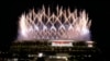 Fireworks illuminate over the National Stadium during the opening ceremony of the 2020 Summer Olympics, Friday, July 23, 2021, in Tokyo. (AP Photo/Shuji Kajiyama)