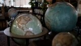 Various size of globes are displayed at a studio in London, Tuesday, Feb. 27, 2024. Globes in the age of Google Earth capture the imagination and serve as snapshots of how the owners see the world and their place in it. (AP Photo/Kin Cheung)