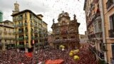 People fill the town hall square waiting for the launch of the 'Chupinazo' rocket, to mark the official opening of the 2022 San Fermin festival in Pamplona, Spain, on July 6, 2022. (AP Photo/Alvaro Barrientos)