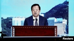 A screen displaying Xia Baolong, director of the Hong Kong and Macau Affairs Office, during the National Security Education Day opening ceremony in Hong Kong, China, April 15, 2024. 