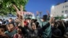 Palestinians celebrate in the streets following Hamas's announcement that it accepted a cease-fire proposal in Deir al-Balah, Gaza Strip on May 6, 2024. Despite the Hamas announcement, Israel said later it would move forward with its planned offensive on Rafah.