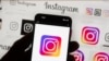 FILE - The Instagram logo is seen on a cell phone on Oct. 14, 2022. Thousands of users of Meta's Facebook, Instagram and Threads platforms experienced login issues on March 5, 2024, in what appeared to be a widespread outage.