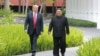FILE - North Korea's leader Kim Jong Un, right, walks with U.S. President Donald Trump at the Capella Hotel on Sentosa island in Singapore, in this picture taken June 12, 2018, and released from North Korea's Korean Central News Agency. 