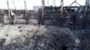 Anggota dari Kementerian Darurat Rusia dan sejumlah pekerja tampak membersihkan puing-puing dari Gedung Crocus yang terbakar menyusul serangan teror yang terjadi di gedung tersebut, di luar Kota Moskow, Rusia, pada 26 Maret 2024. (Foto: Kementerian Darurat/Handout via Reuters)