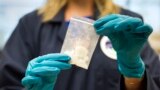(FILE) A bag of fentanyl which was seized in a drug raid is displayed at the DEA Special Testing and Research Laboratory in Sterling, VA.