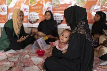 Rohingya refugee mothers learn about nutrition at a UNICEF-supported therapeutic feeding center for malnourished children in Jamtoli camp, Cox's Bazar district, Bangladesh, on 23 May 2018.
