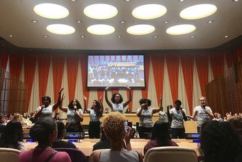 A group of teen advocates for girls rights perform a skit on the barriers women and girls face in social life, school, and the workforce during the 