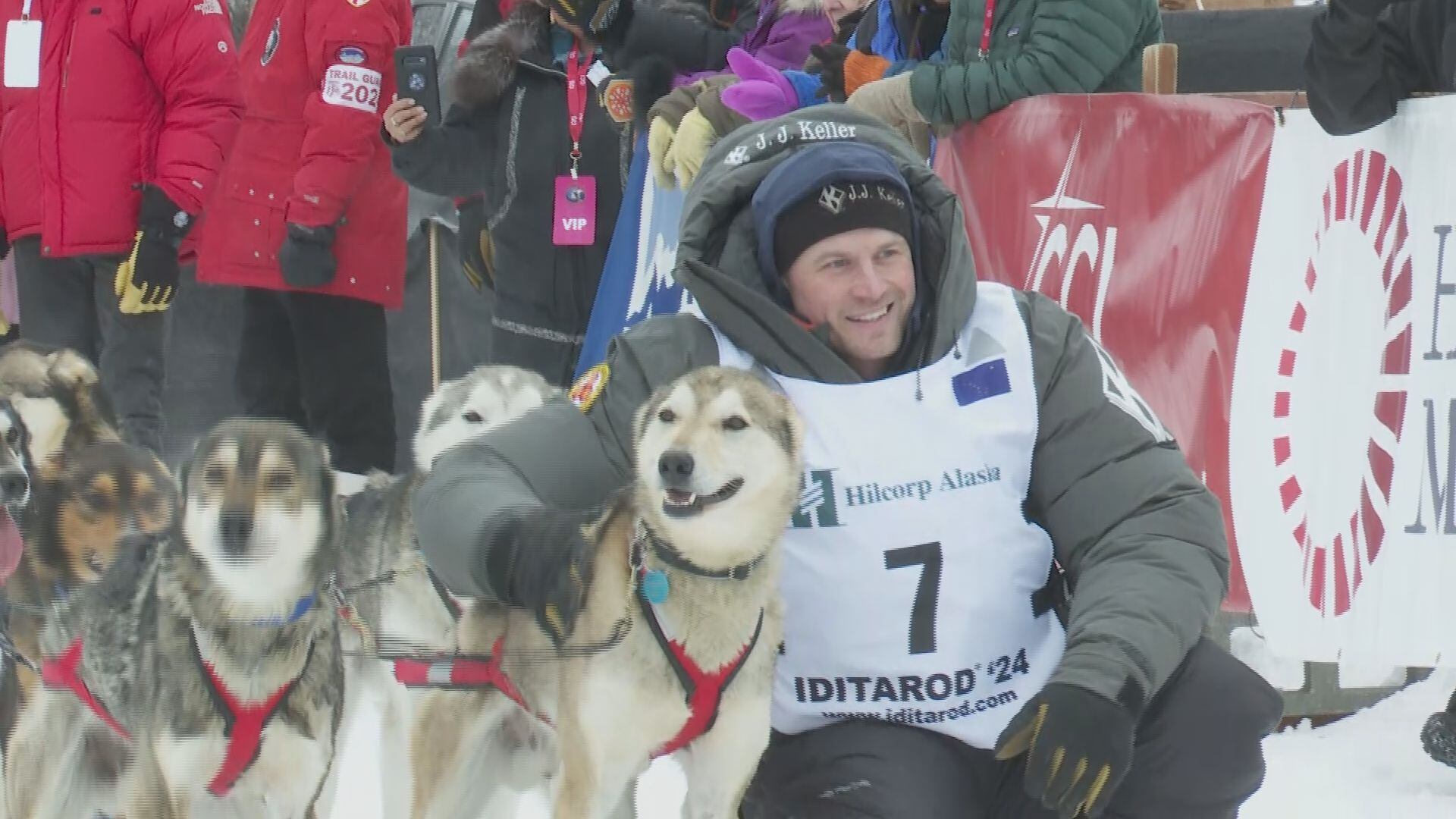 Dallas Seavey poses with his lead dogs at the Willow Restart of Iditarod 2024.