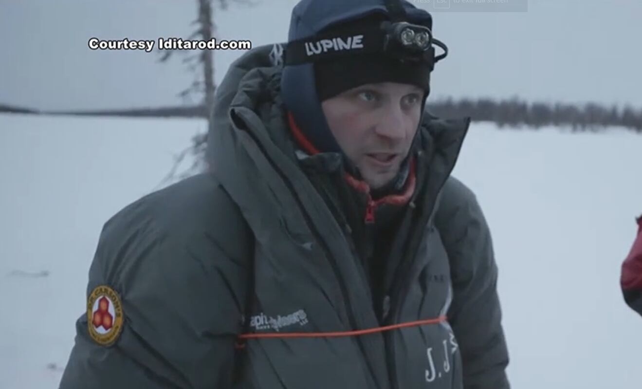 Dallas Seavey speaks to race officials in the 2024 Iditarod.