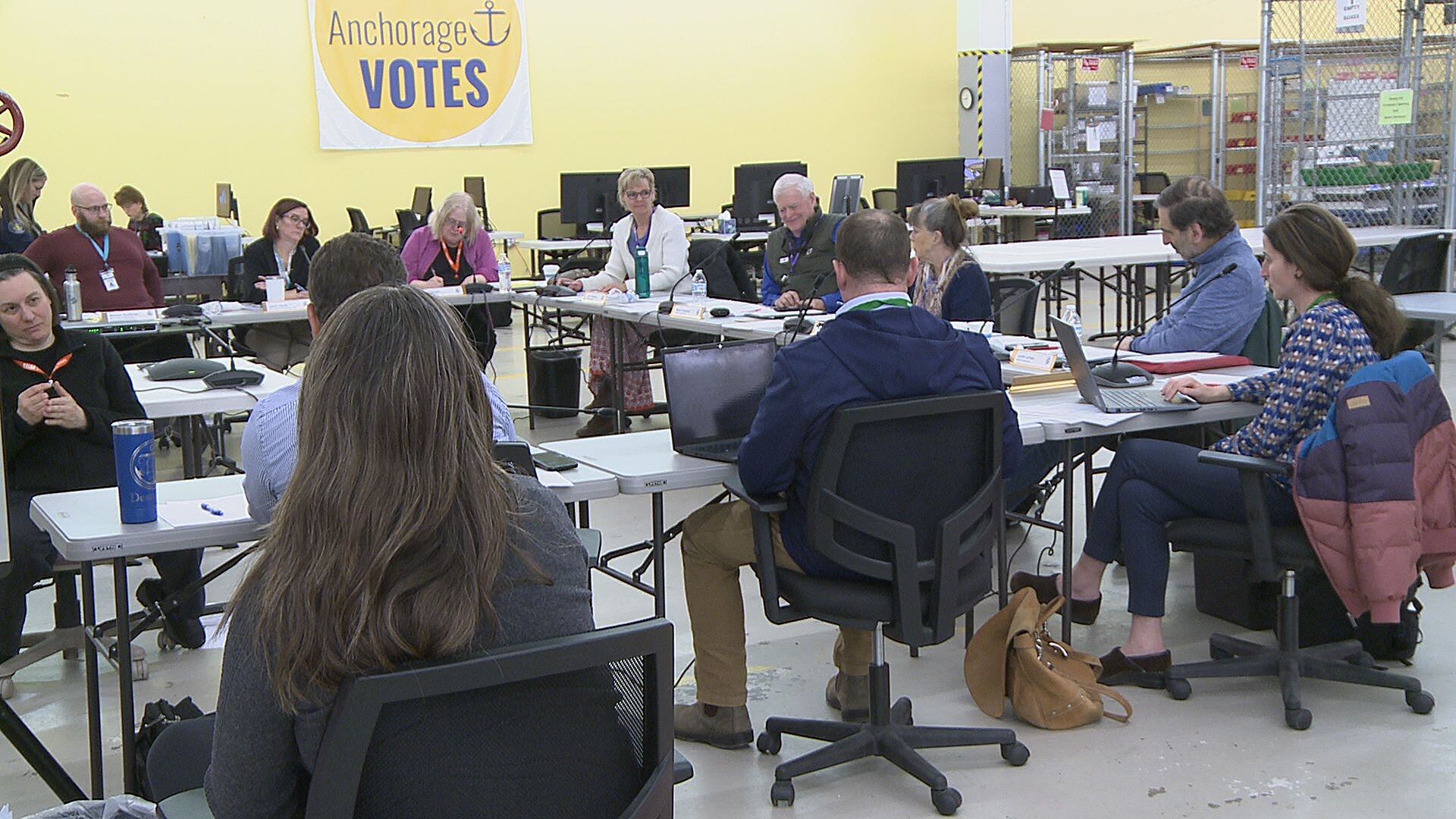 Members of the Anchorage Election Commission consider rejected ballots from the municipal...