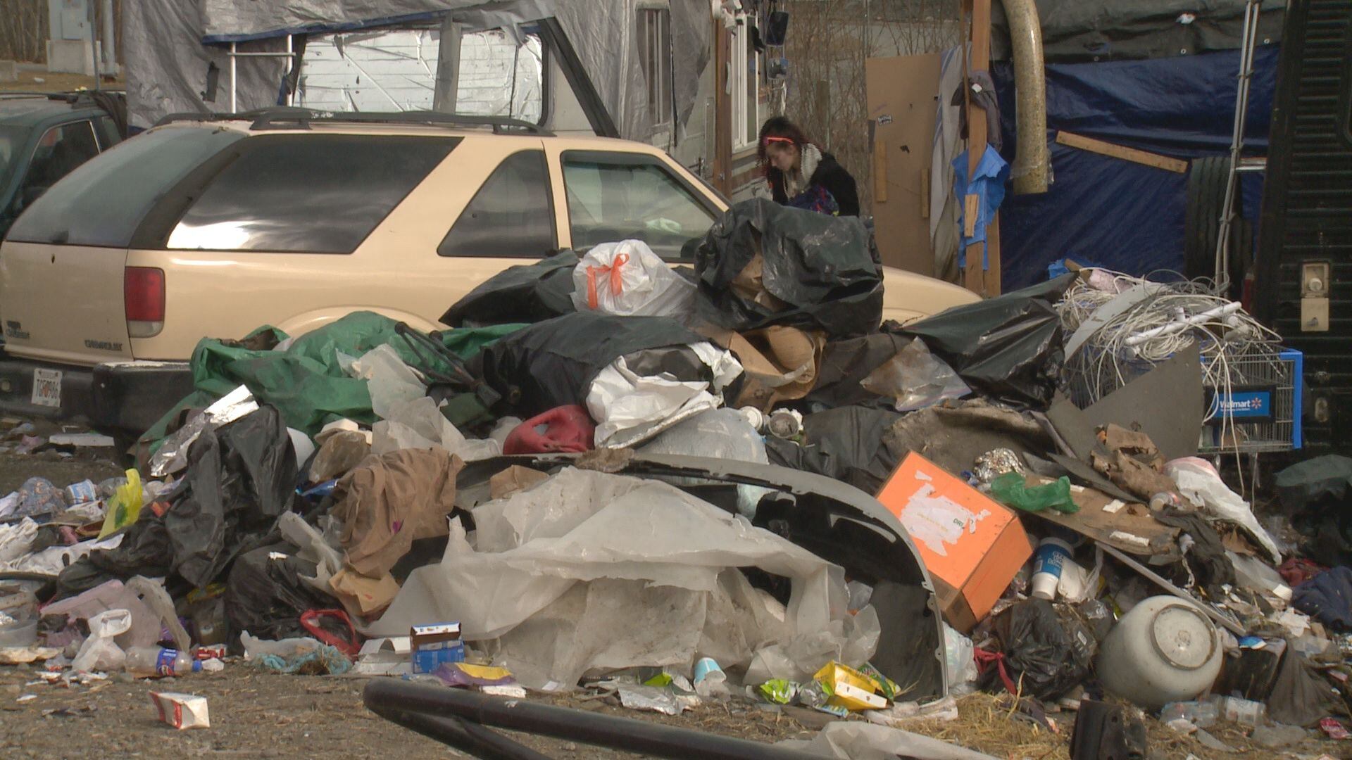 Abatement at a midtown homeless camp continued on Wednesday